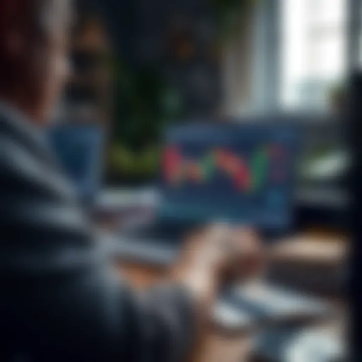 Person using laptop with forex trading platform open, surrounded by educational materials